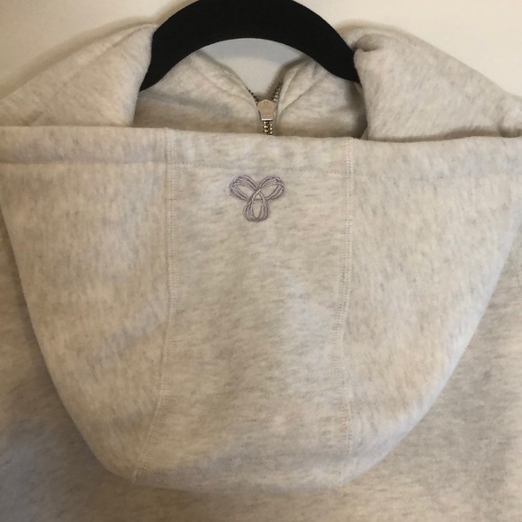 Very light grey TNA zip up with light purple logo - Picture 5 of 11